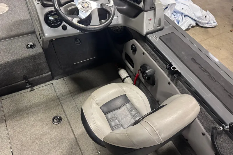 Slide: The Image of 2017 Tracker Targa V-18 WT boat interior with steering wheel and seat. - 5