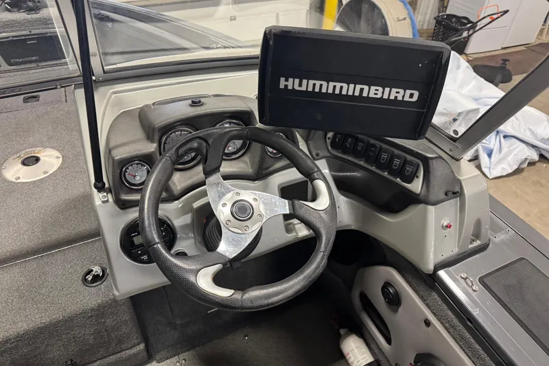Slide: The Image of 2017 Tracker Targa V-18 WT boat dashboard with Humminbird display and steering wheel. - 6