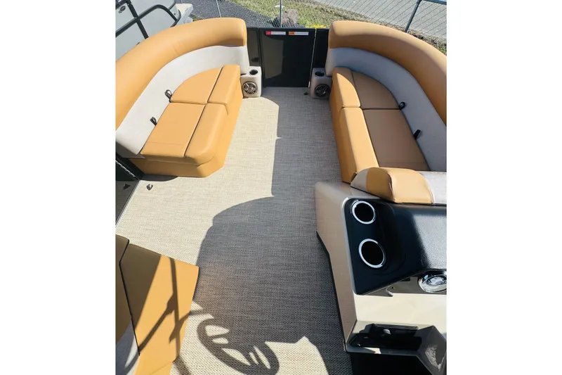 Slide: The Image of Interior of 2026 Crest Conquest SE 200 Cruise pontoon boat with tan seating and carpet. - 12