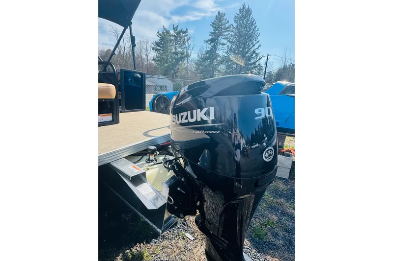 Slide: The Image of 2026 Crest Conquest SE 200 Cruise with Suzuki 90 outboard motor in outdoor setting. - 8