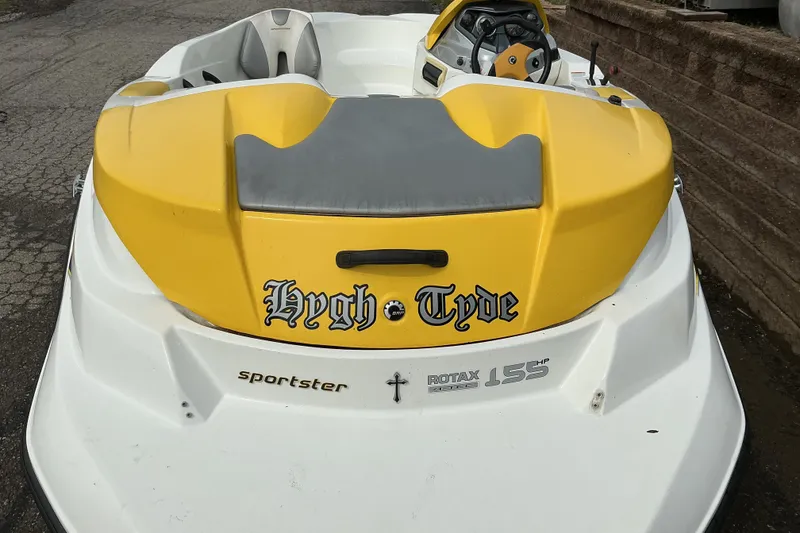 Slide: The Image of 2005 Sea-Doo Sportster boat with yellow and white design, featuring "Hygh Tyde" text. - 5