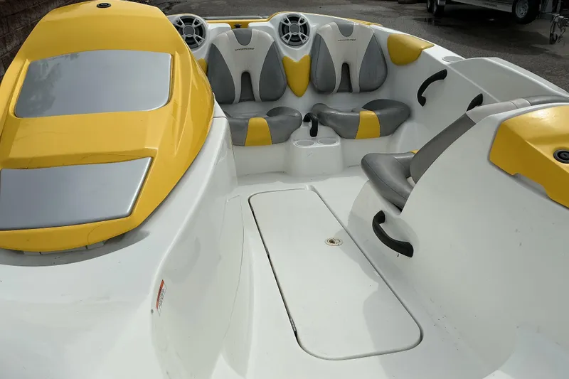 Slide: The Image of 2005 Sea-Doo Sportster boat interior with yellow and gray seating, featuring modern design elements. - 7