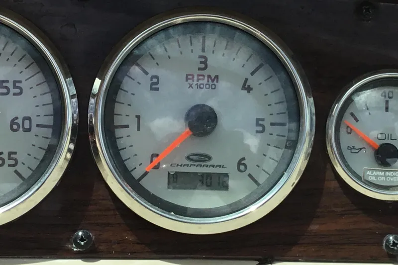 Slide: The Image of Close-up of 2005 Chaparral Sunesta 216 dashboard gauges, showing RPM and oil indicators. - 10