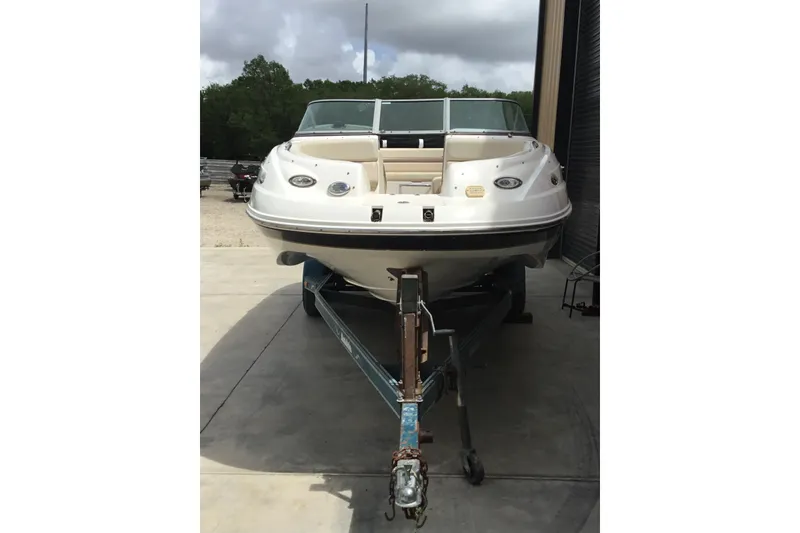 Slide: The Image of 2005 Chaparral Sunesta 216 boat on trailer, parked outdoors. - 3