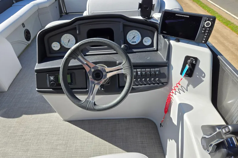 Slide: The Image of 2022 Bentley Pontoons 240 Cruise XL Legacy dashboard with steering wheel and controls. - 12