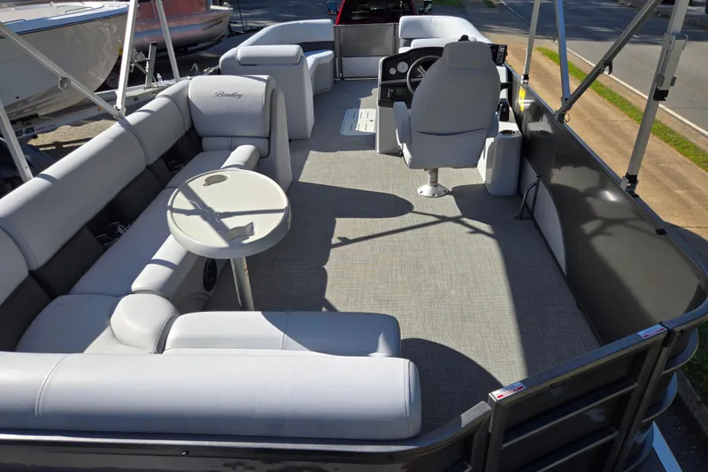 Slide: The Image of 2022 Bentley Pontoons 240 Cruise XL Legacy interior with plush seating and modern helm. - 20