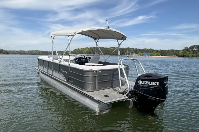 Slide: The Image of 2022 Bentley Pontoons 240 Cruise XL Legacy on water, featuring Suzuki 200HP engine. - 4