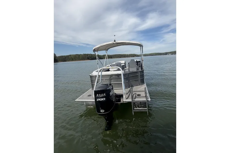 Slide: The Image of 2022 Bentley Pontoons 240 Cruise XL Legacy on water, featuring 200HP engine. - 6