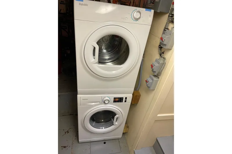 Slide: The Image of Stacked washer and dryer in 1985 Hatteras 60 Convertible yacht laundry area. - 20