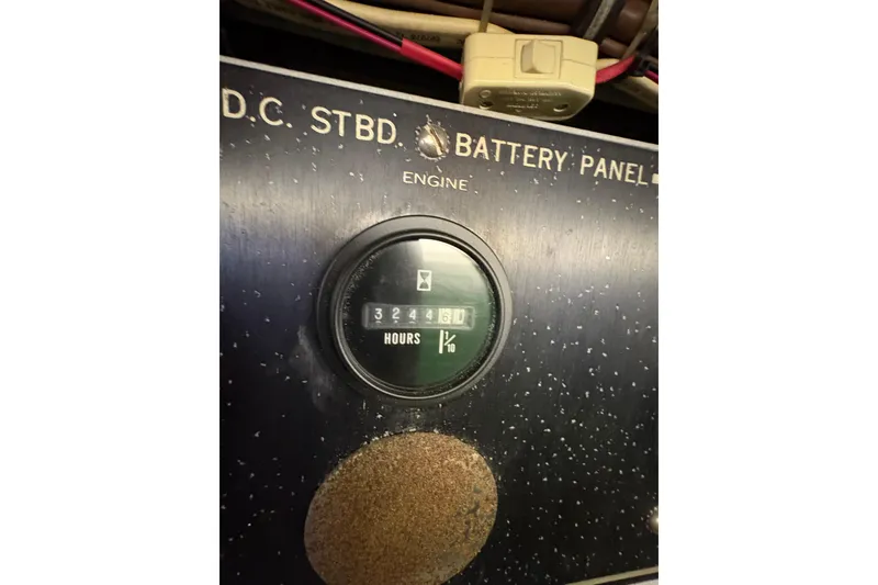 Slide: The Image of Hour meter on 1985 Hatteras 60 Convertible engine panel showing 3244.6 hours. - 43
