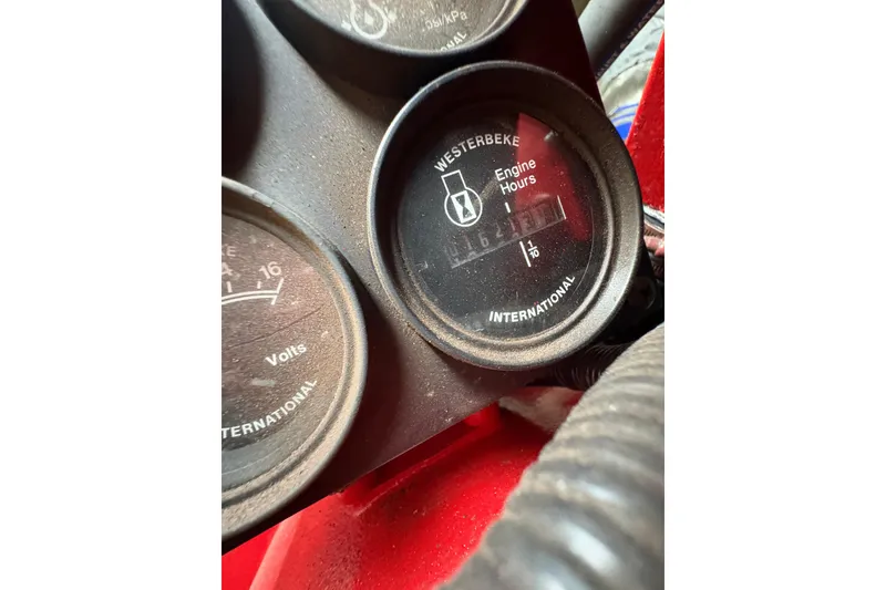 Slide: The Image of Close-up of engine hour meter on 1985 Hatteras 60 Convertible boat dashboard. - 48