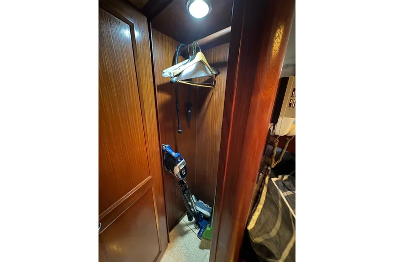 Slide: The Image of Wooden closet interior on 1985 Hatteras 60 Convertible yacht. - 66