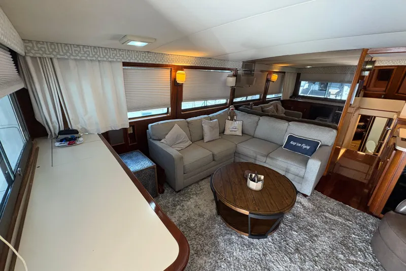 Slide: The Image of Luxurious interior of 1985 Hatteras 60 Convertible yacht with plush seating and elegant decor. - 84