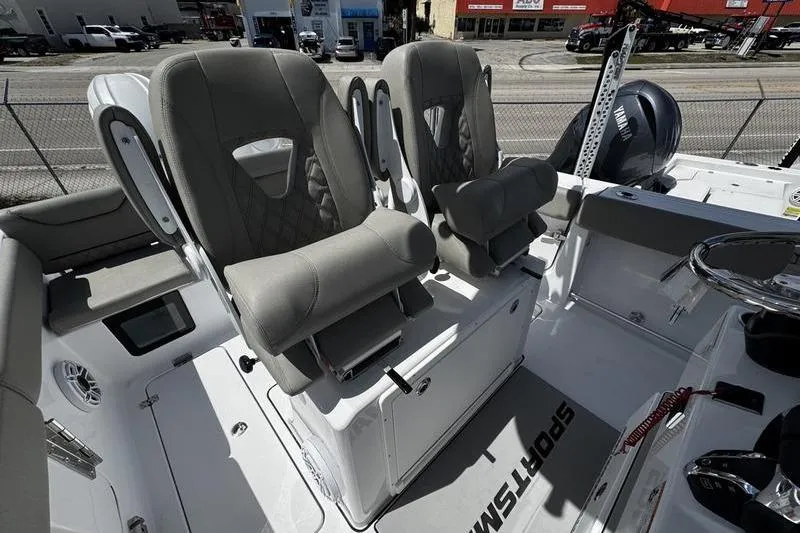 Slide: The Image of 2026 Sportsman Heritage 261 Center Console boat interior with dual cushioned seats. - 17
