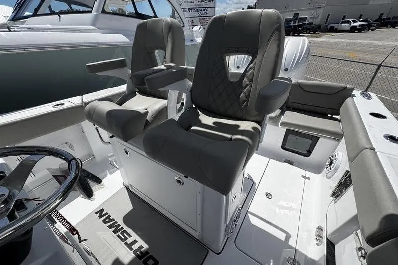 Slide: The Image of 2026 Sportsman Heritage 261 Center Console boat with luxurious seating and modern design. - 18