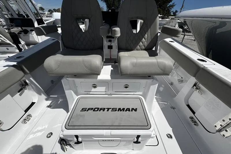 Slide: The Image of 2026 Sportsman Heritage 261 Center Console boat interior with dual seats and storage. - 20