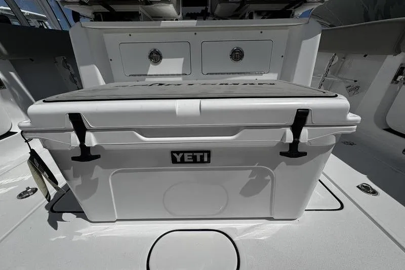 Slide: The Image of YETI cooler on 2026 Sportsman Heritage 261 Center Console boat deck. - 22