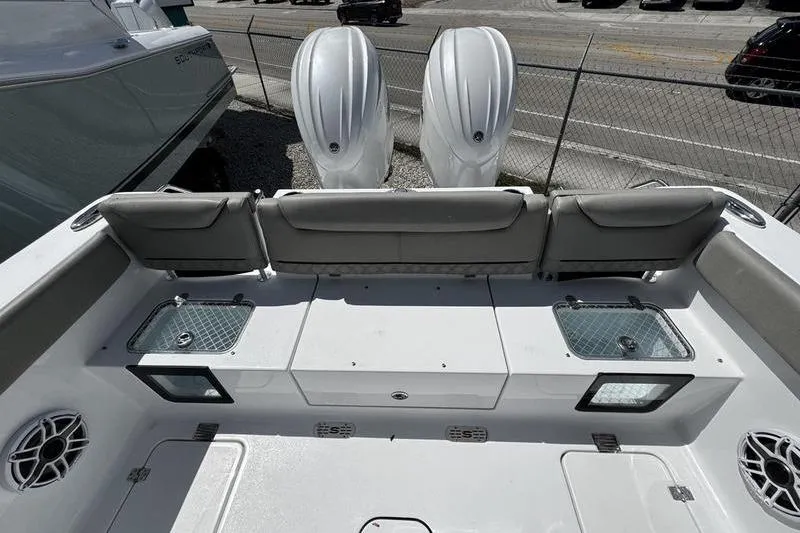 Slide: The Image of 2026 Sportsman Heritage 261 Center Console boat with dual engines and spacious seating. - 24