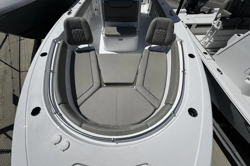 Slide: The Image of 2026 Sportsman Heritage 261 Center Console boat with spacious seating area. - 4