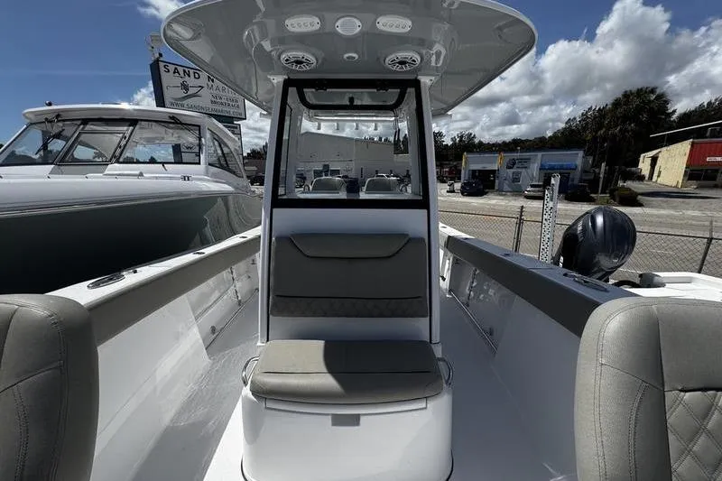 Slide: The Image of 2026 Sportsman Heritage 261 Center Console boat interior with seating and console view. - 6