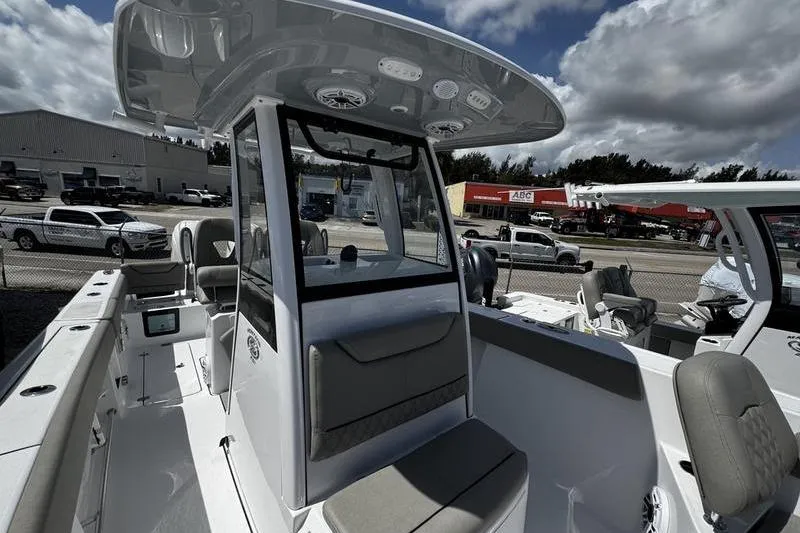 Slide: The Image of 2026 Sportsman Heritage 261 Center Console boat interior with seating and dashboard. - 7