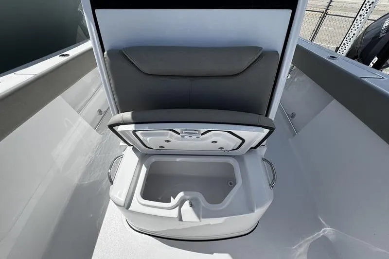 Slide: The Image of 2026 Sportsman Heritage 261 Center Console boat with open storage compartment. - 9