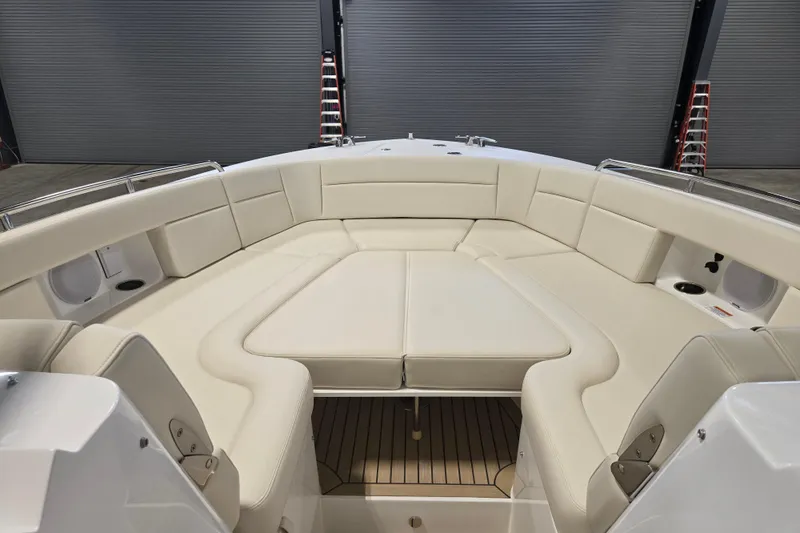 Slide: The Image of Luxurious seating area on 2026 MJM 3 boat, featuring cream upholstery and sleek design. - 12