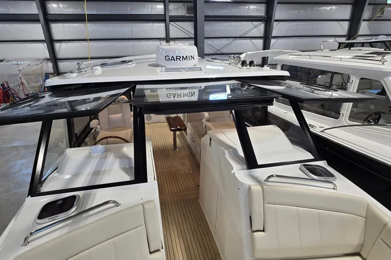 Slide: The Image of 2026 MJM 3 boat interior with Garmin navigation, featuring sleek design and spacious seating. - 15