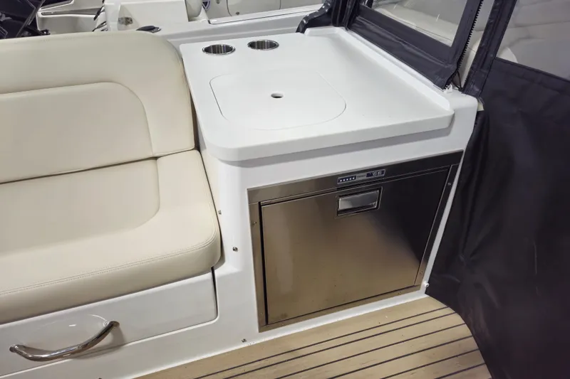 Slide: The Image of Luxury seating and kitchenette area on 2026 MJM 3 boat model. - 17