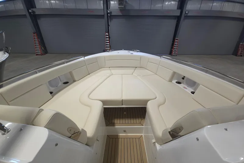 Slide: The Image of Luxurious seating area on a 2026 MJM 3 boat, featuring elegant cream upholstery. - 2
