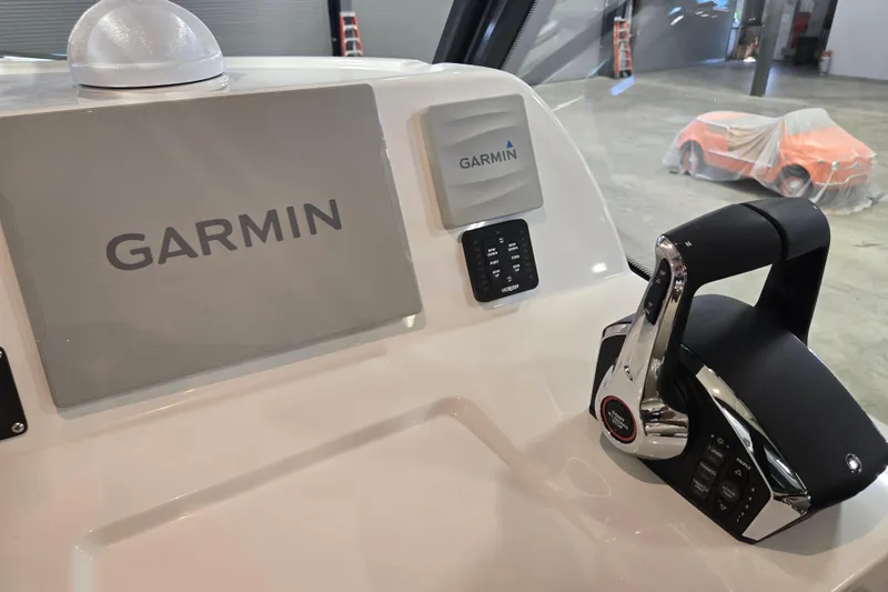 Slide: The Image of Control panel of 2026 MJM 3 boat featuring Garmin navigation system. - 21