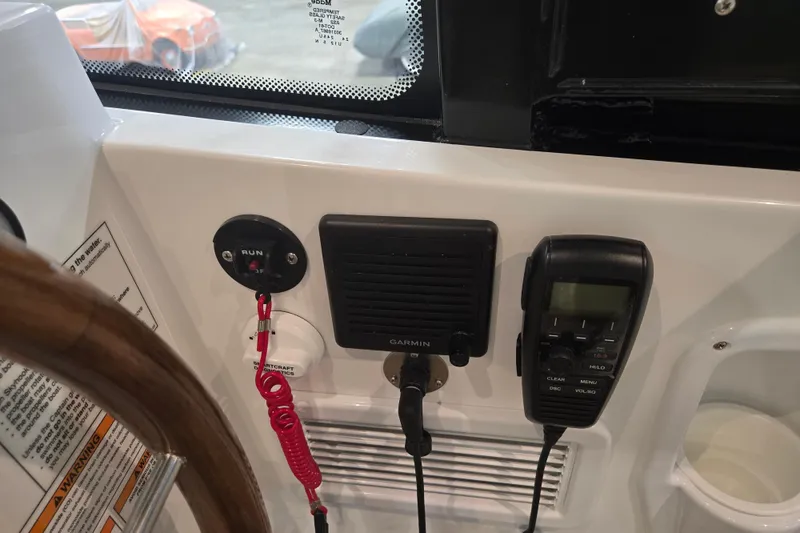 Slide: The Image of Control panel of 2026 MJM 3 boat with Garmin device and radio. - 22