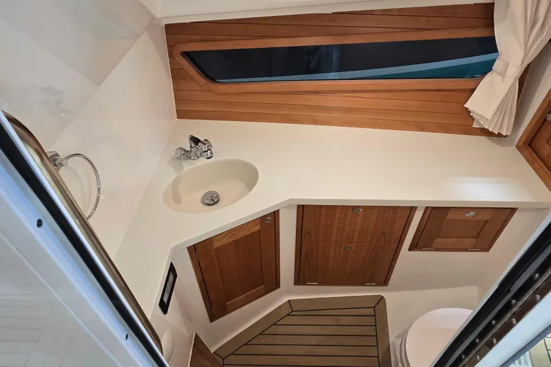 Slide: The Image of Modern boat bathroom interior with wooden accents, sink, and window in 2026 MJM 3 model. - 23