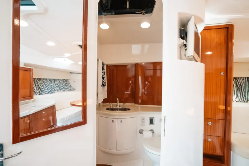 Slide: The Image of Luxurious 2009 Intrepid 475 Sport Yacht interior with elegant wood finishes and modern amenities. - 20