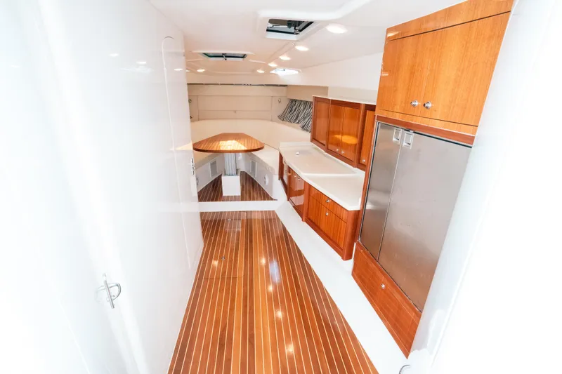 Slide: The Image of Luxurious interior of 2009 Intrepid 475 Sport Yacht with wood flooring and modern cabinetry. - 24