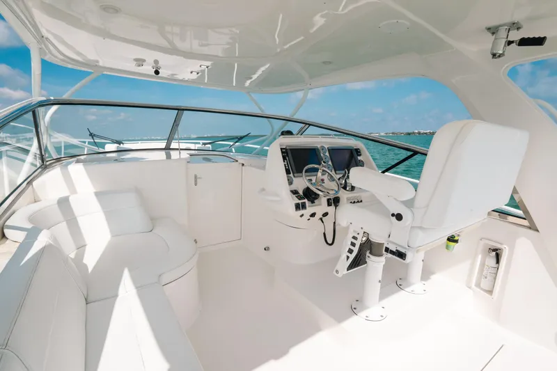 Slide: The Image of Luxurious 2009 Intrepid 475 Sport Yacht cockpit with white seating and modern controls. - 33