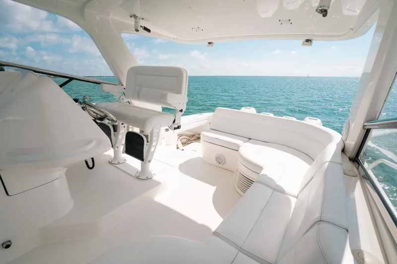 Slide: The Image of Luxurious 2009 Intrepid 475 Sport Yacht interior with white seating, overlooking the ocean. - 34