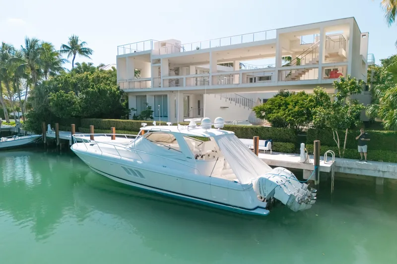 Slide: The Image of Luxurious 2009 Intrepid 475 Sport Yacht docked by modern waterfront home. - 42