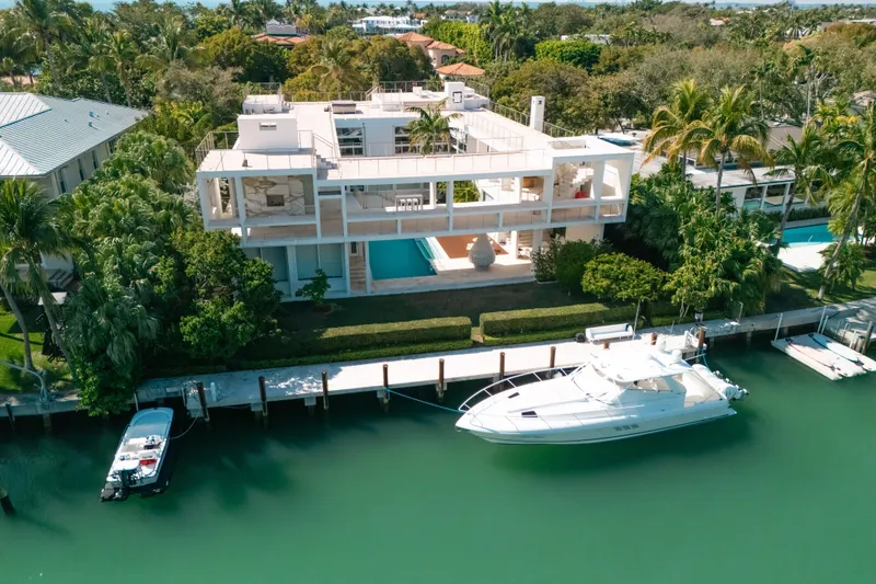 Slide: The Image of Aerial view of a luxurious waterfront property with a 2009 Intrepid 475 Sport Yacht docked. - 43