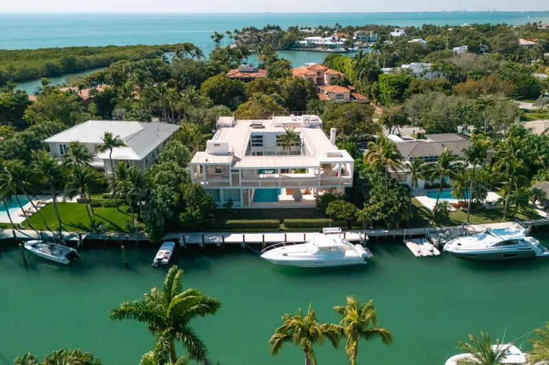 Slide: The Image of Aerial view of luxury waterfront homes with yachts, including a 2009 Intrepid 475 Sport Yacht. - 44