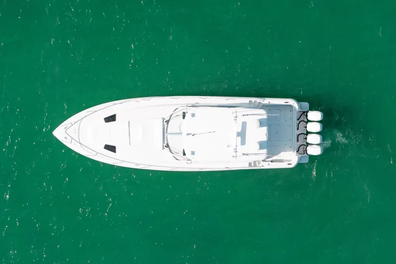 Slide: The Image of Aerial view of 2009 Intrepid 475 Sport Yacht on turquoise water. - 48