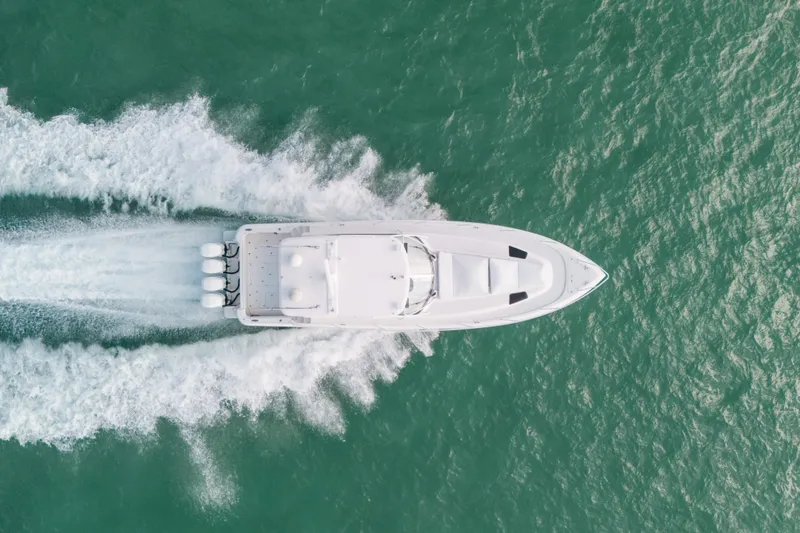 Slide: The Image of Aerial view of 2009 Intrepid 475 Sport Yacht cruising on turquoise water. - 66