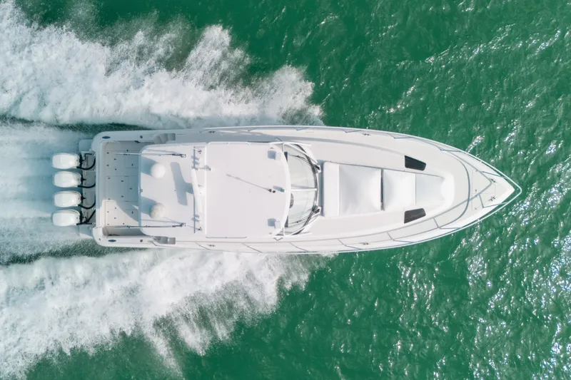 Slide: The Image of Aerial view of 2009 Intrepid 475 Sport Yacht cruising on turquoise water. - 67