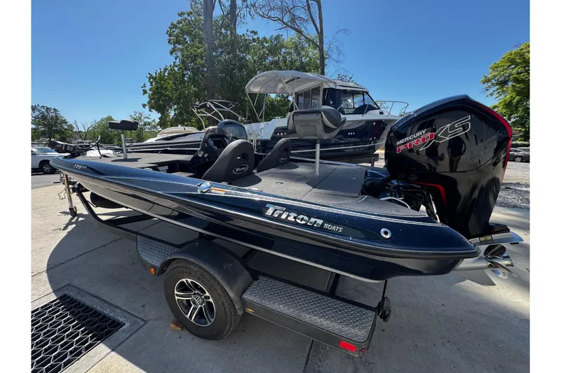 Slide: The Image of 2022 Triton 179 TrX boat with Mercury Pro XS engine, parked on a trailer. - 10