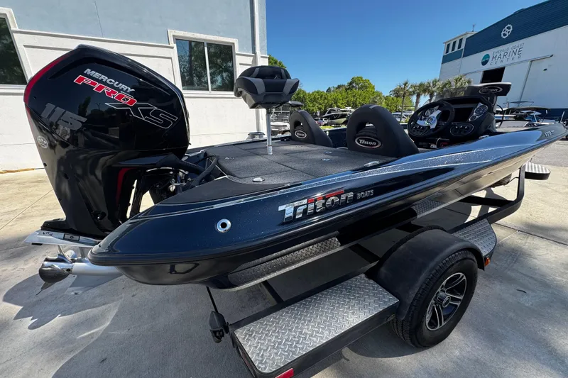 Slide: The Image of 2022 Triton 179 TrX boat with Mercury Pro XS engine on trailer. - 3
