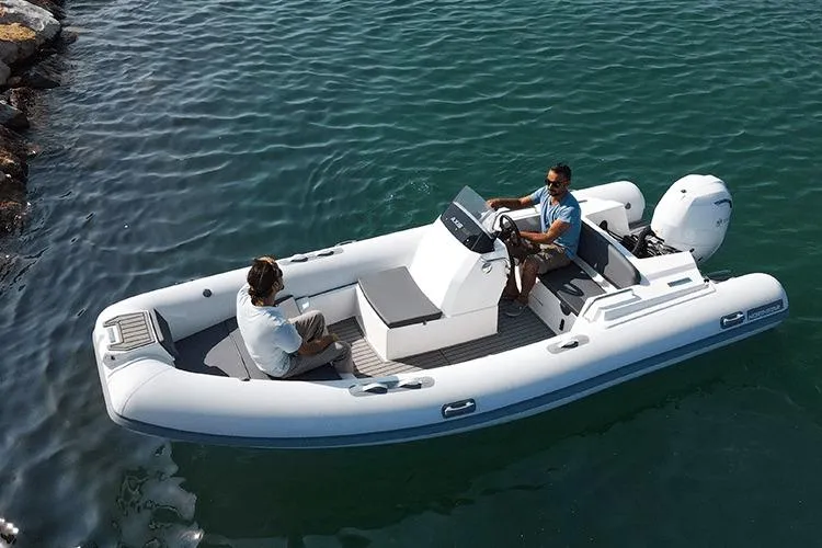 The Image of 2026 Northstar Axis 5.3 boat on water with two people onboard. - 1