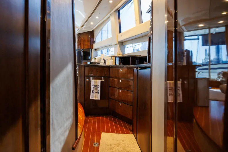 Slide: The Image of Luxurious interior of 2010 Meridian 391 Sedan yacht with wooden cabinetry and modern amenities. - 17