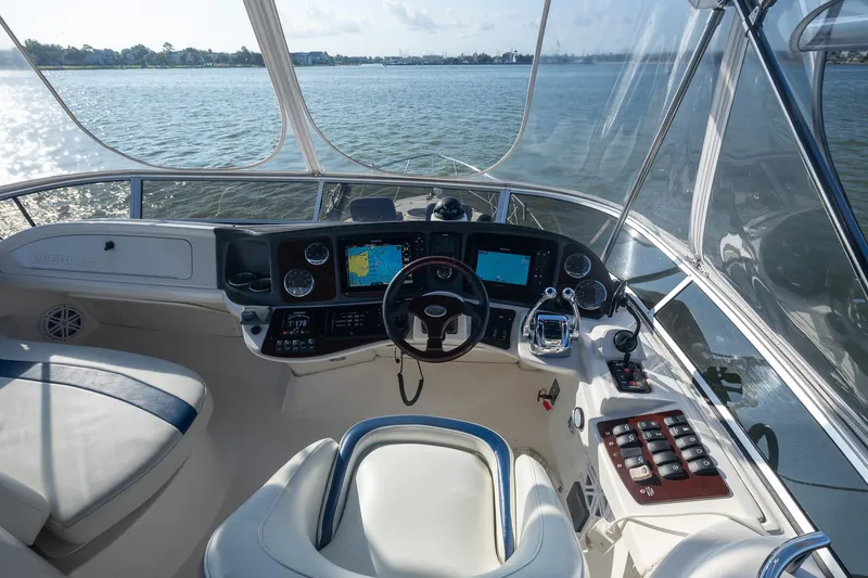Slide: The Image of Cockpit view of 2010 Meridian 391 Sedan yacht with navigation equipment and steering wheel. - 27