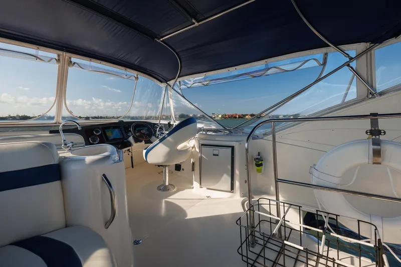 Slide: The Image of Interior view of 2010 Meridian 391 Sedan yacht cockpit with steering and seating. - 29