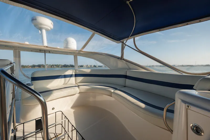 Slide: The Image of Luxurious seating area on a 2010 Meridian 391 Sedan yacht with scenic water views. - 32